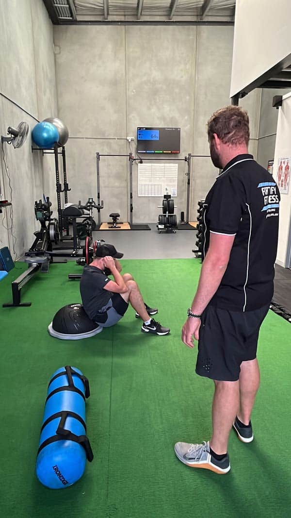 Client doing ab work at Fortify Fitness.