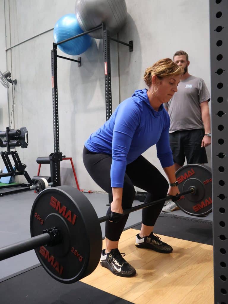 Personal Trainer Coaching Female Client